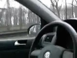 caucasian man plays with dick while driving